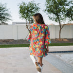 Rear view of Viola Mini Dress with tiered skirt and ruffled 3/4 sleeves.