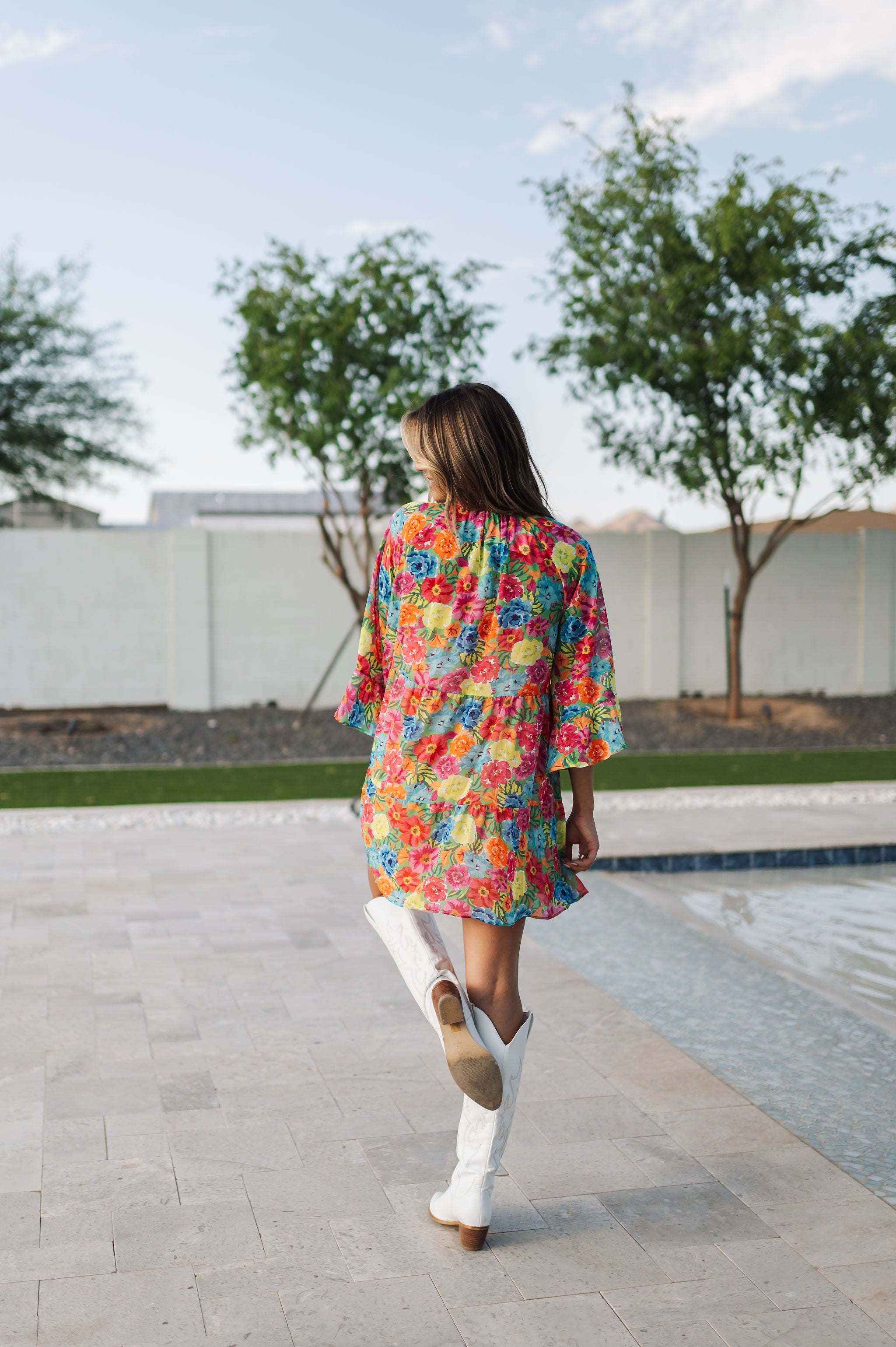 Rear view of Viola Mini Dress with tiered skirt and ruffled 3/4 sleeves.