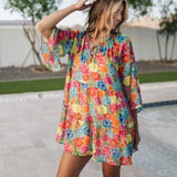 Front view of Viola Mini Dress with tiered skirt, tie front detail, and ruffled 3/4 sleeves
