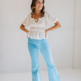 Front view of East Coast Flare jeans in blue corduroy with flare leg. 
