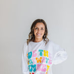 Front view of oversized crew cut Stanley Sweatshirt with neon graphic. 