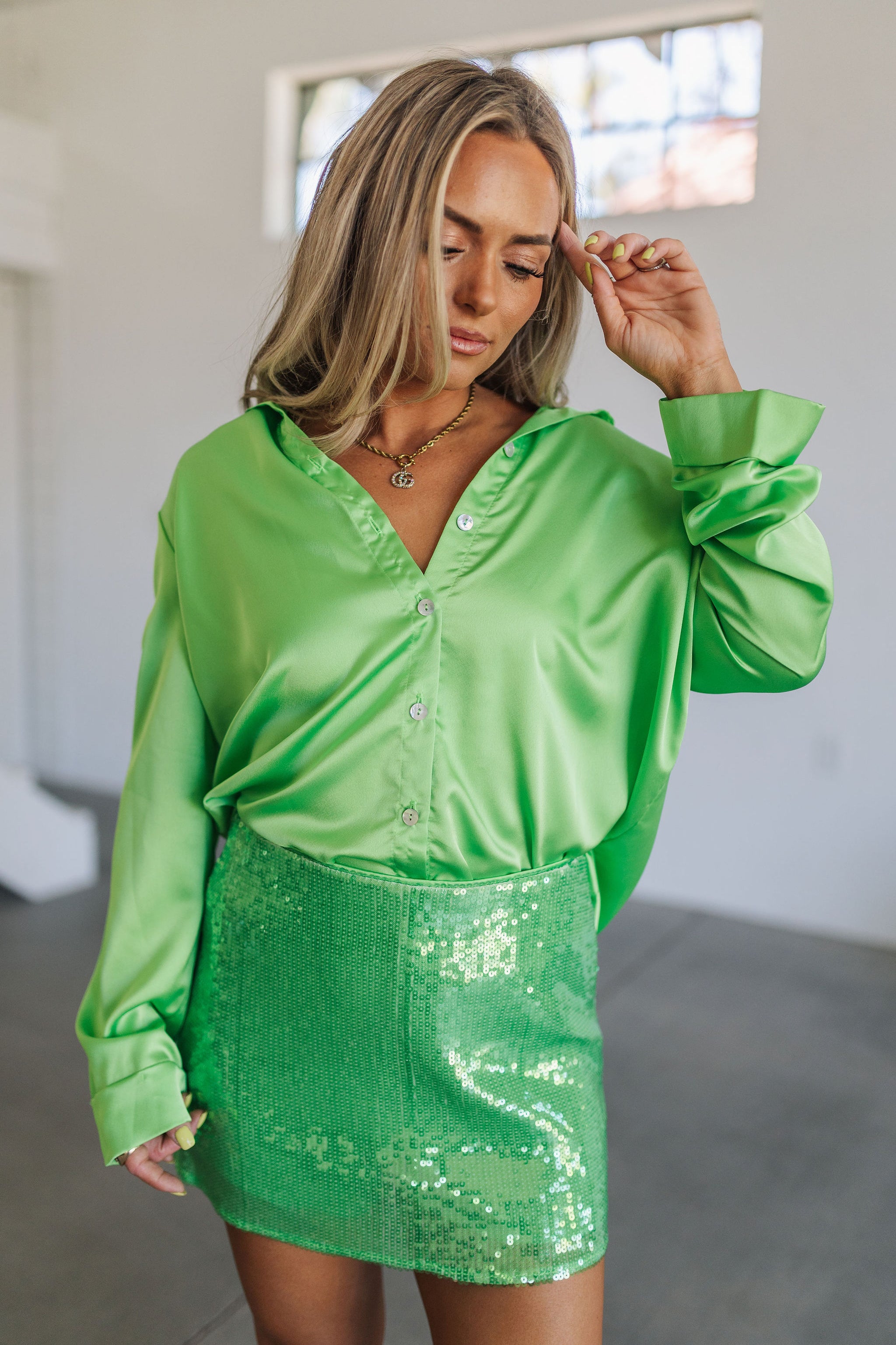 Front view of Smith Button Down in bright green luxe satin with button up front and collar neckline. 
