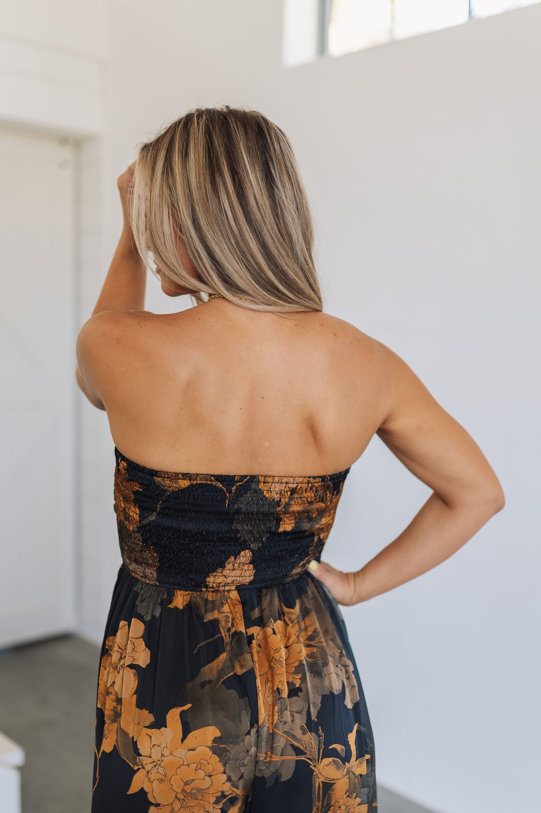Rear view of Athens Jumpsuit with smocked tube top.
