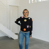 Front view of Stars And Smiles Sweater with allover stars and smile polka dot pattern. 