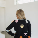 Rear view of Stars And Smiles Sweater with allover stars and smile polka dot pattern. 