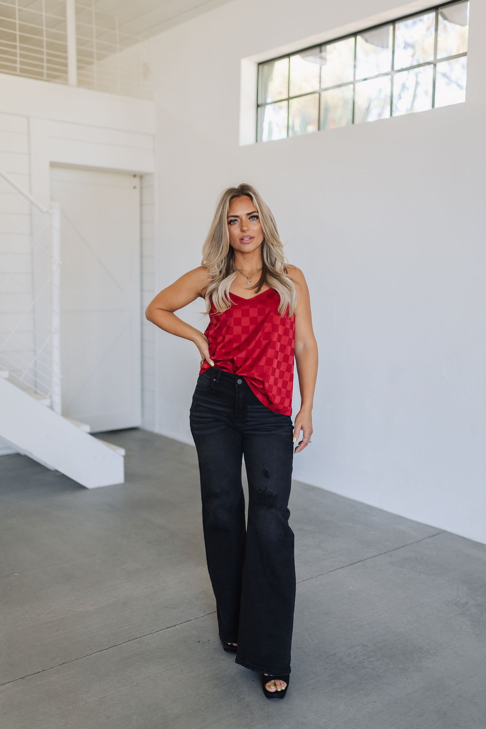 Front view of Spotlight Tank with spaghetti straps and allover red checkered satin print. 