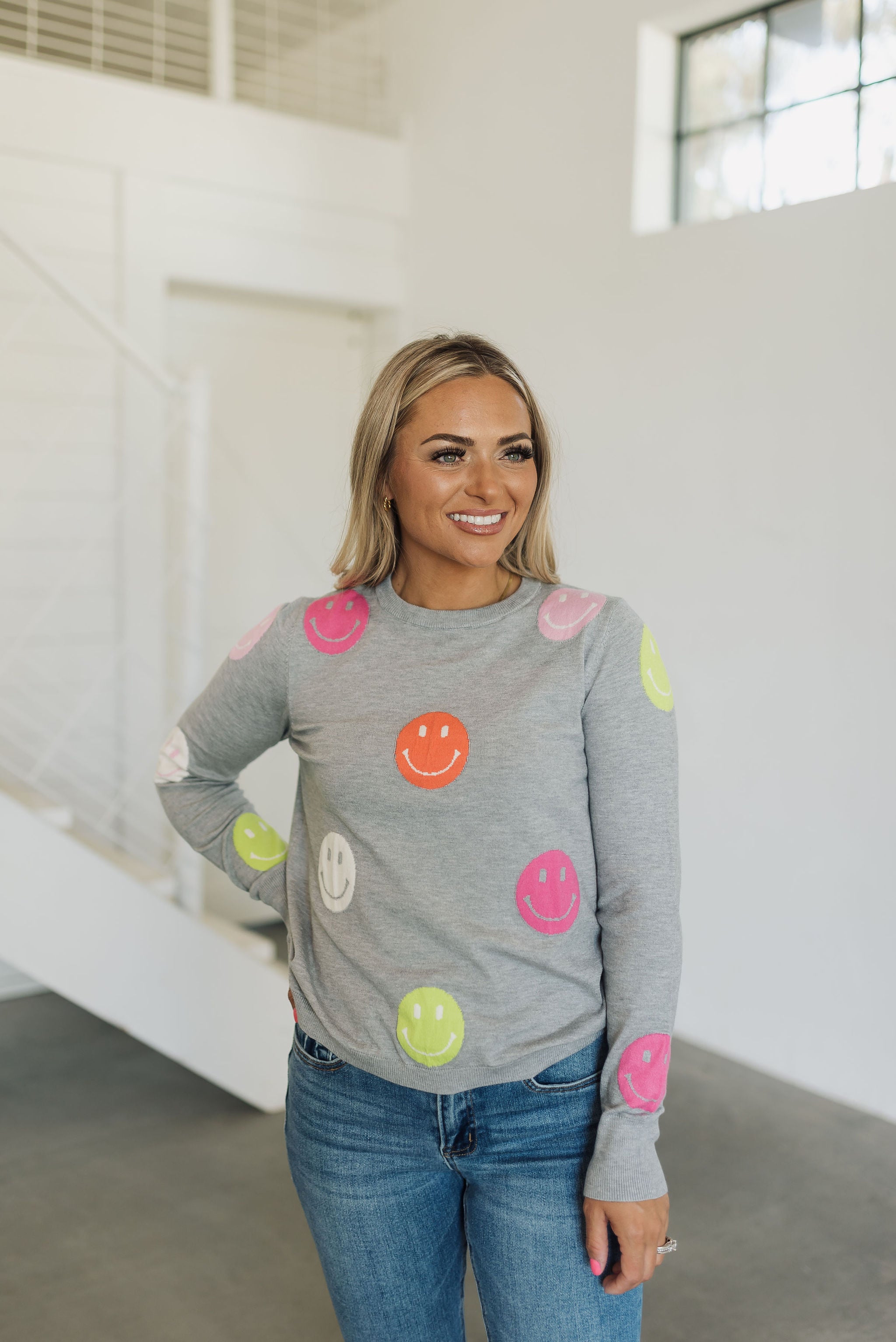 Front view of All Smiles Sweater with allover smile polka dot pattern.