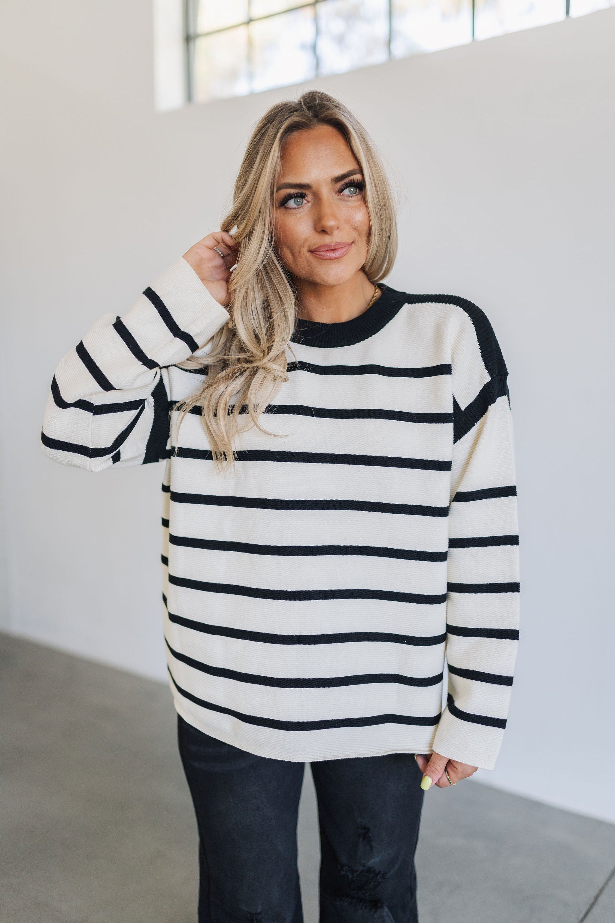 Front view of Oslo Stripe Sweater with dropped shoulders and relaxed fit. 
