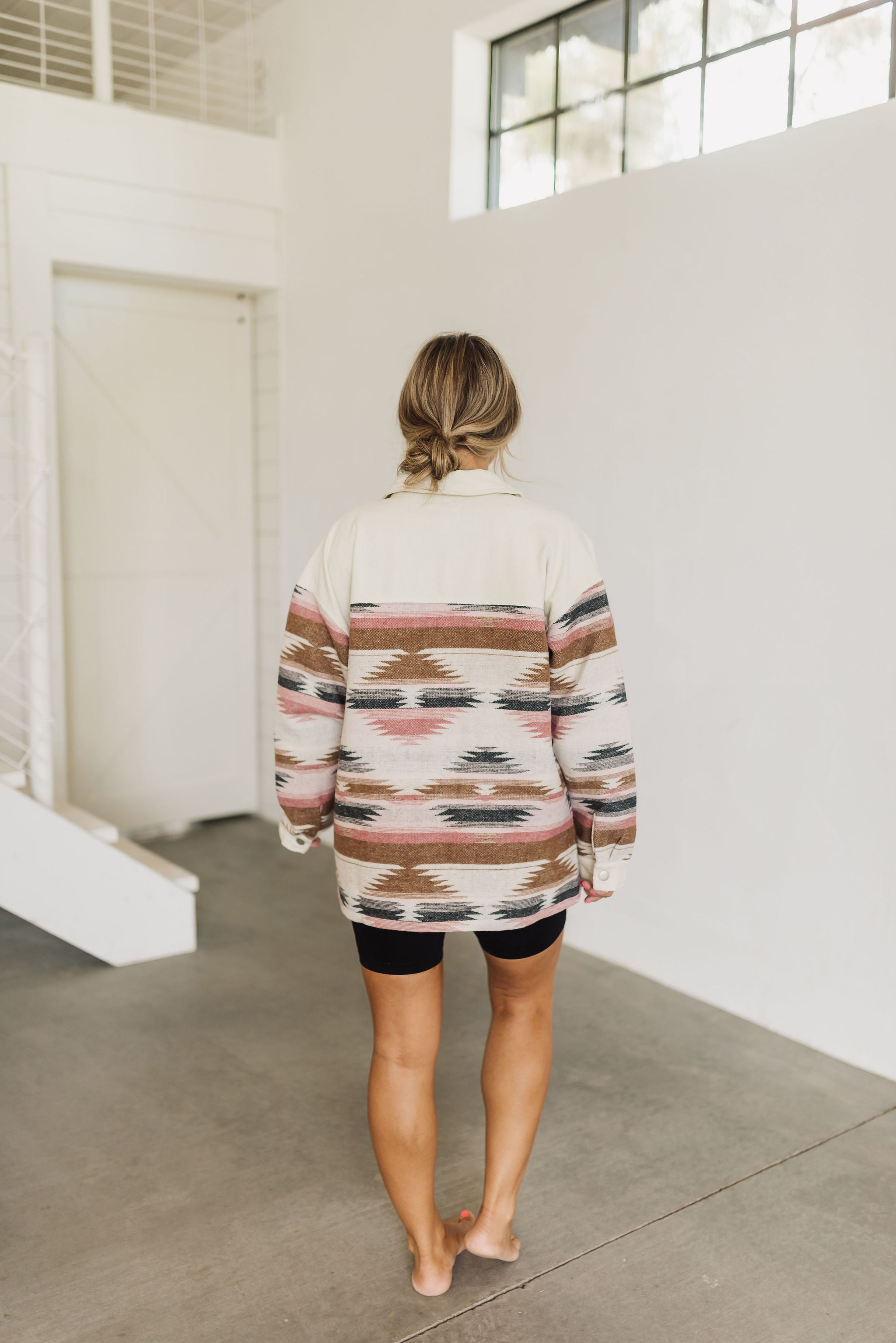 Rear view of Aztec Shacket with allover aztec print.