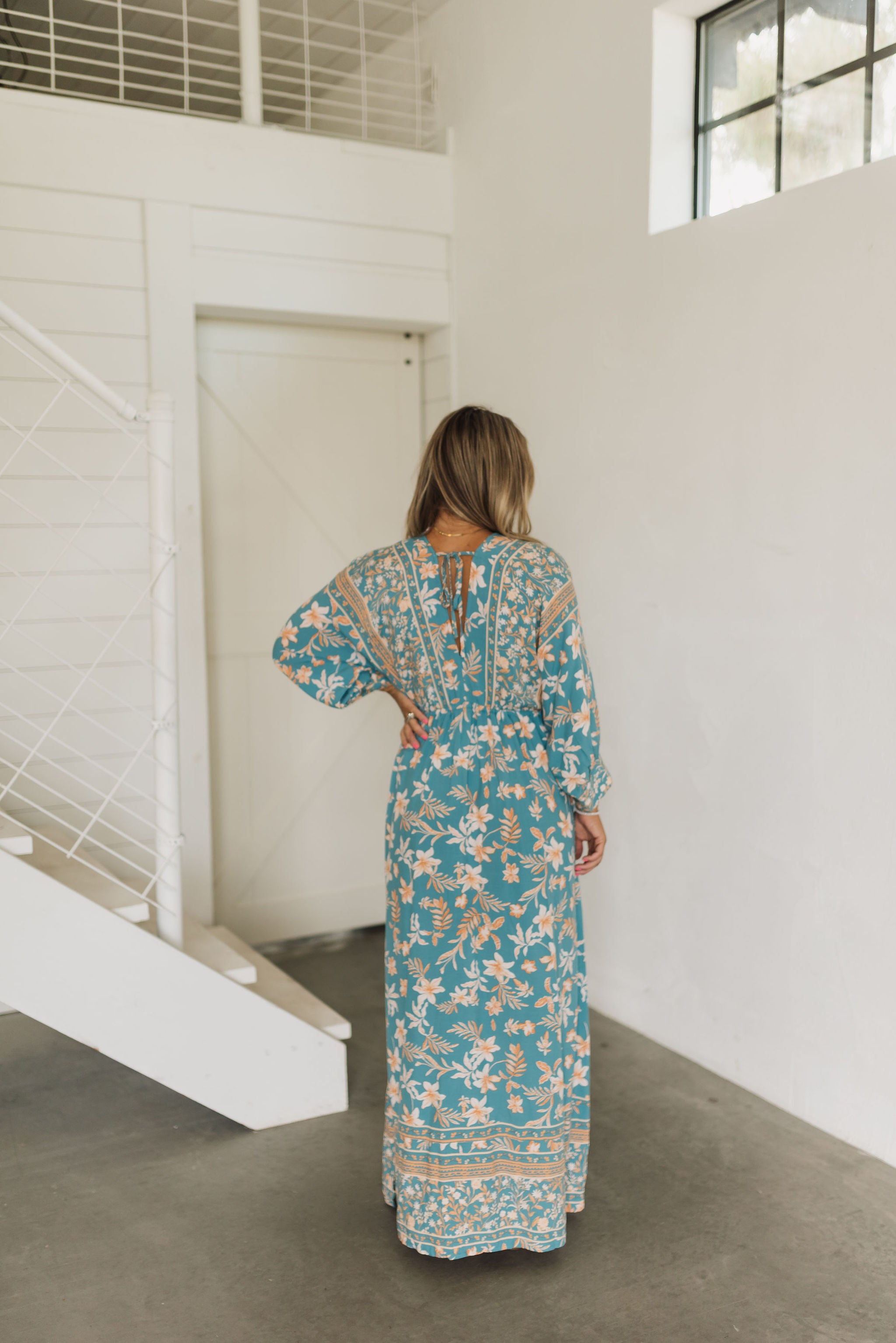 Rear view of Ocean Drive Maxi Dress with dolman sleeves and tie-back waist.