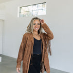 Front angled view of Dutton Fringe Suede Jacket in cocoa with fringe detailing at chest and arms.  