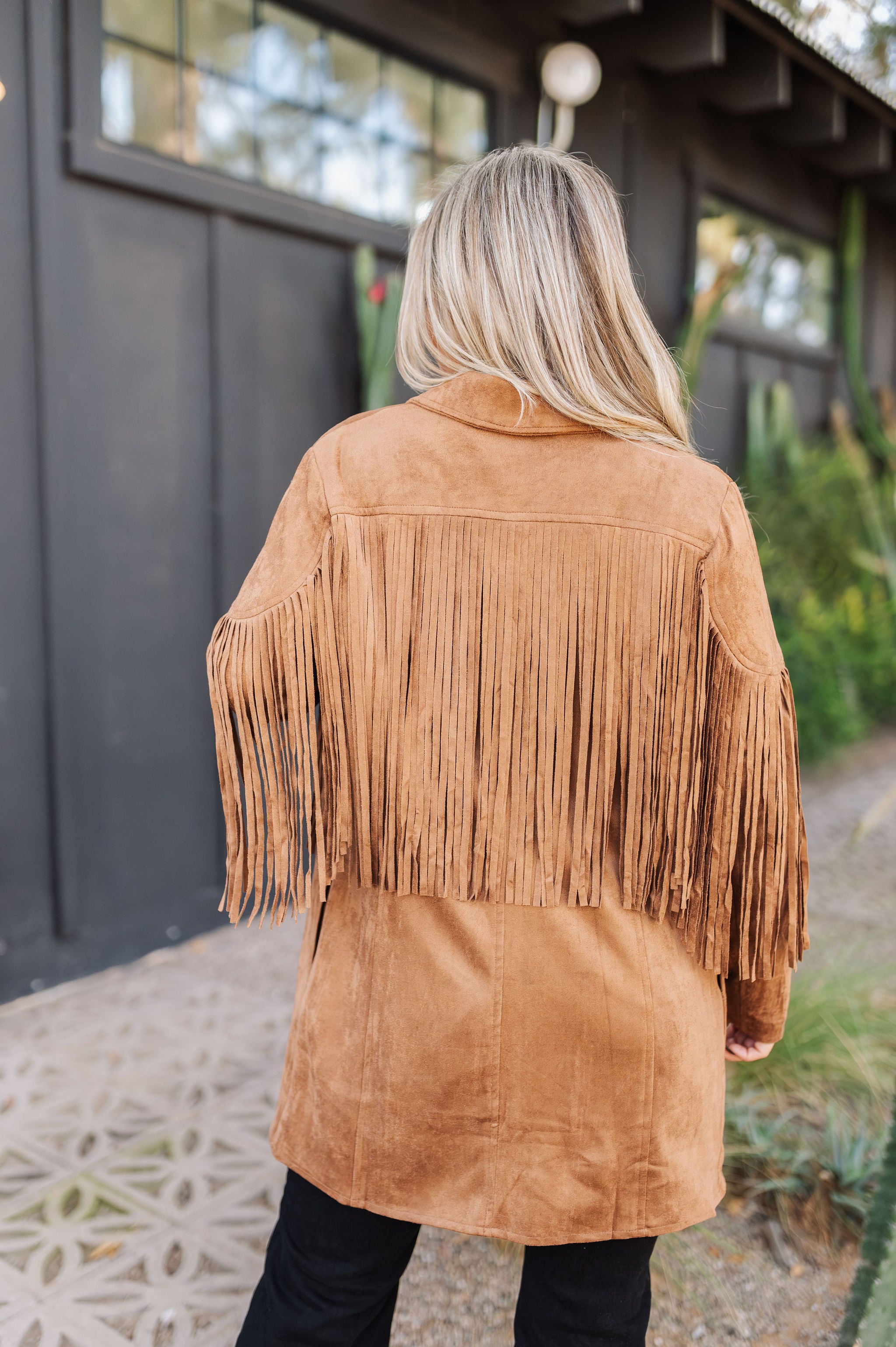Rear view of Dutton Fringe Suede Jacket in cocoa with fringe detailing at chest and arms.  