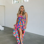 Front view of high-low maxi Ipanema Tie Dess with vibrant allover print and tie front. 