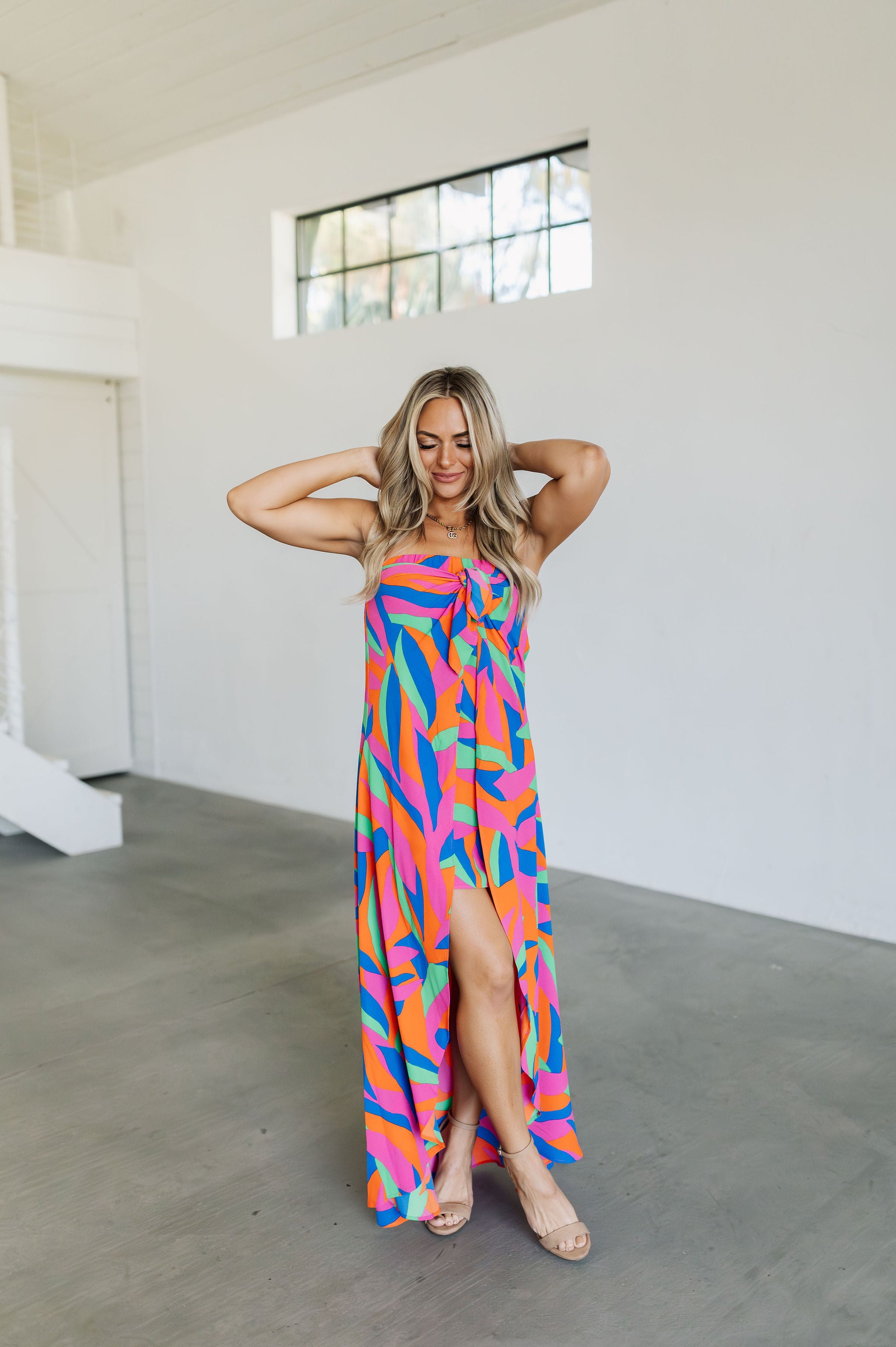 Front view of high-low maxi Ipanema Tie Dess with vibrant allover print and tie front. 