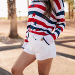 Close up side view of white linen Hendrix Shorts.