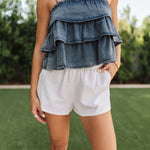 Front view of Ranchers Cascade Tank Top in blue denim color, thin straps, tiered ruffles. 