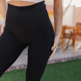 Close up front view Active Compression Legging with moto detailing and high waistband. 