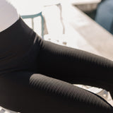 Close up view of Active Compression Legging showing ribbed moto detailing down the legs. 