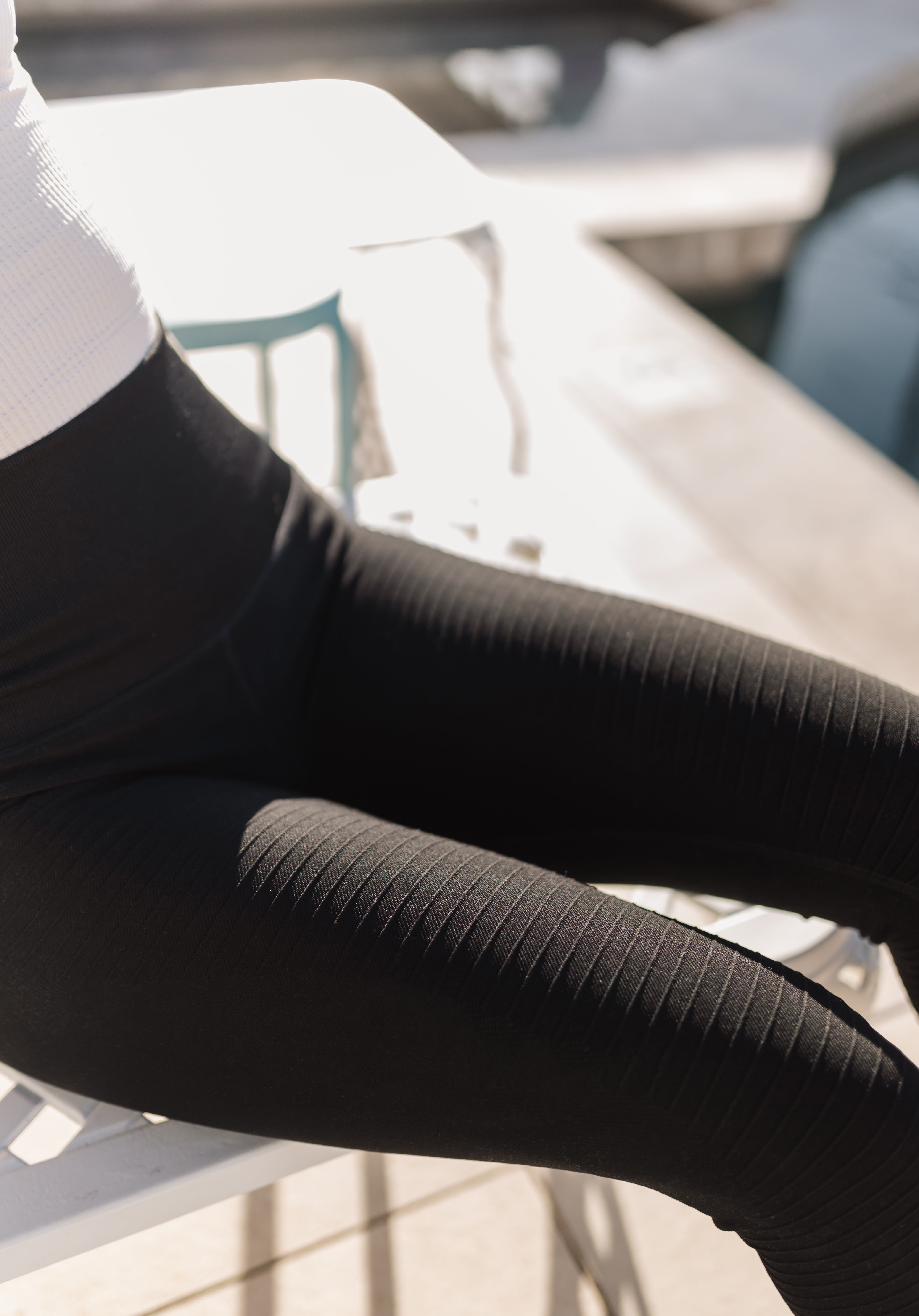 Close up view of Active Compression Legging showing ribbed moto detailing down the legs. 