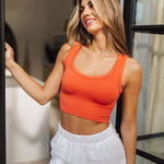 Front view of Deep Scoop Crop Top in a burnt sienna color with scooped neckline and banded hem. 