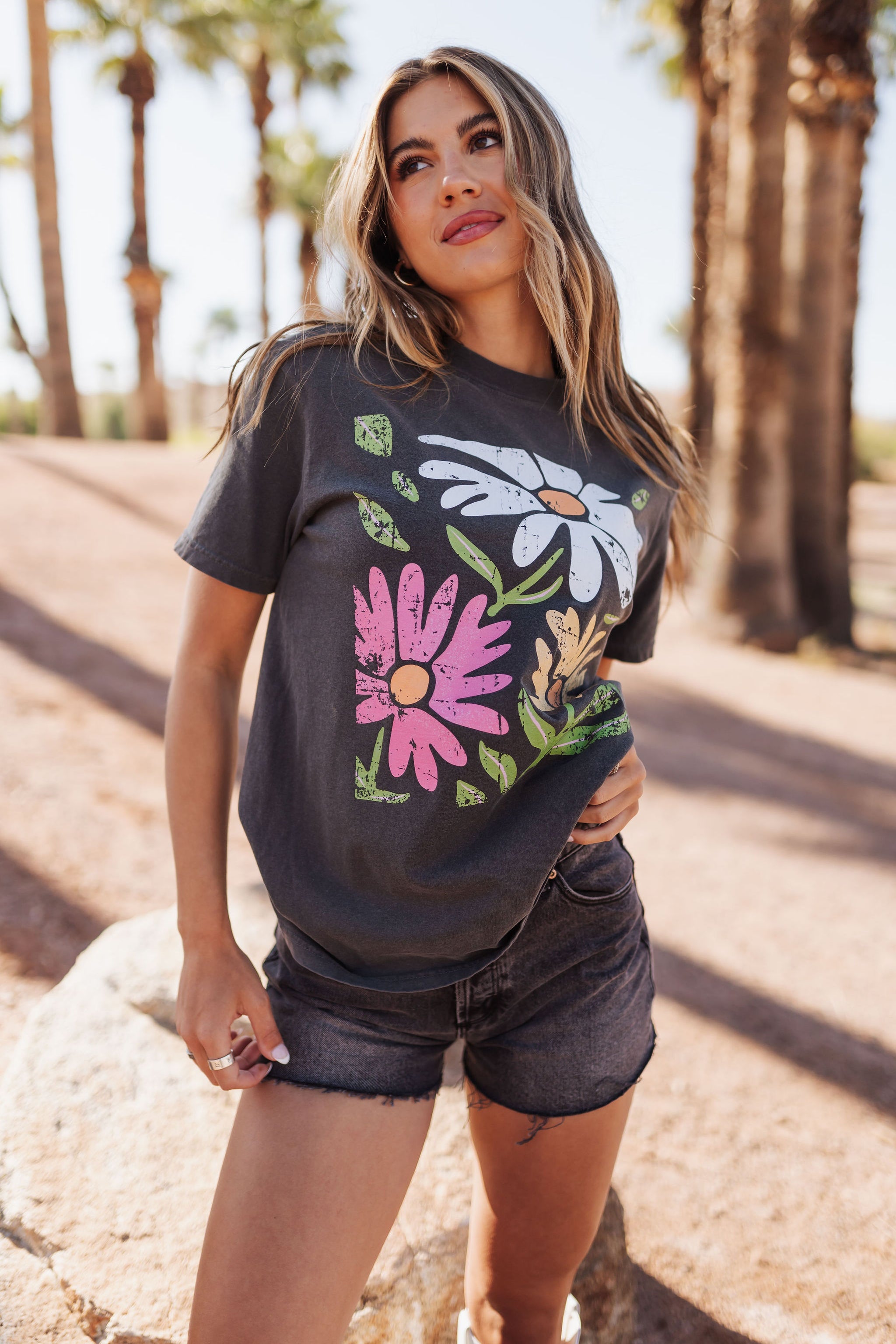 Close up front view of Vintage Daisy Graphic Tee with distressed graphic details. 