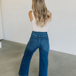 Rear view of wide leg Sailor Jeans in blue denim with angled rear pockets.