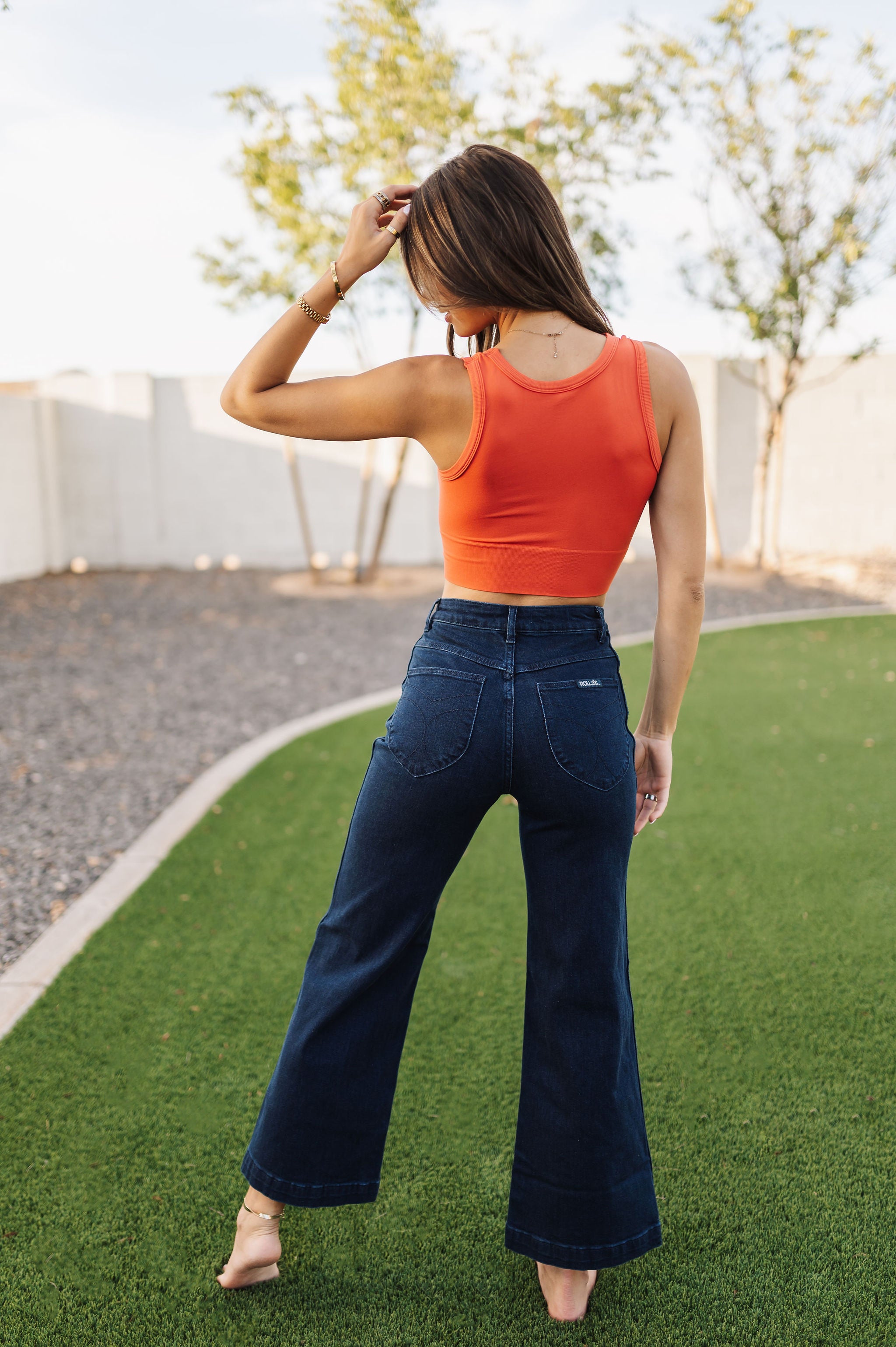 Rear view of Sailor Jean in dark indigo color with wide leg and rear pockets. 