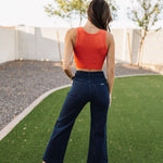 Rear view of Sailor Jean in dark indigo color with wide leg and rear pockets. 