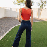 Rear view of Sailor Jean in dark indigo color with wide leg and rear pockets. 