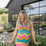Front view of crochet Tara Mini Dress with neon zig zag print.