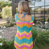 Rear view of crochet Tara Mini Dress with neon zig zag print.
