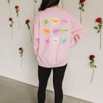 Rear view of The Stanley Sweatshirt crewneck with allover candy heart design.