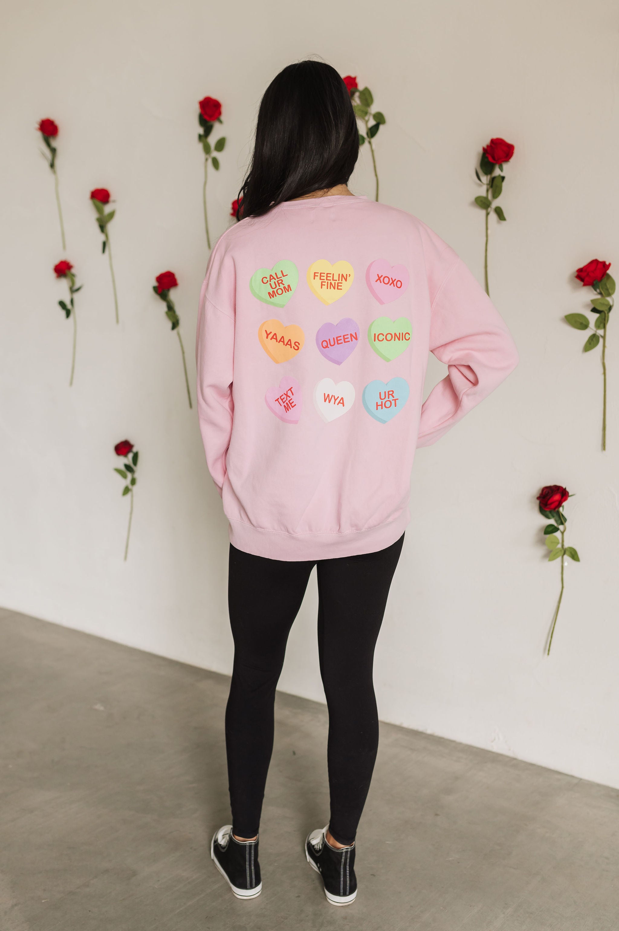 Rear view of The Stanley Sweatshirt crewneck with allover candy heart design.