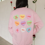 Rear view of The Stanley Sweatshirt crewneck with allover candy heart design.