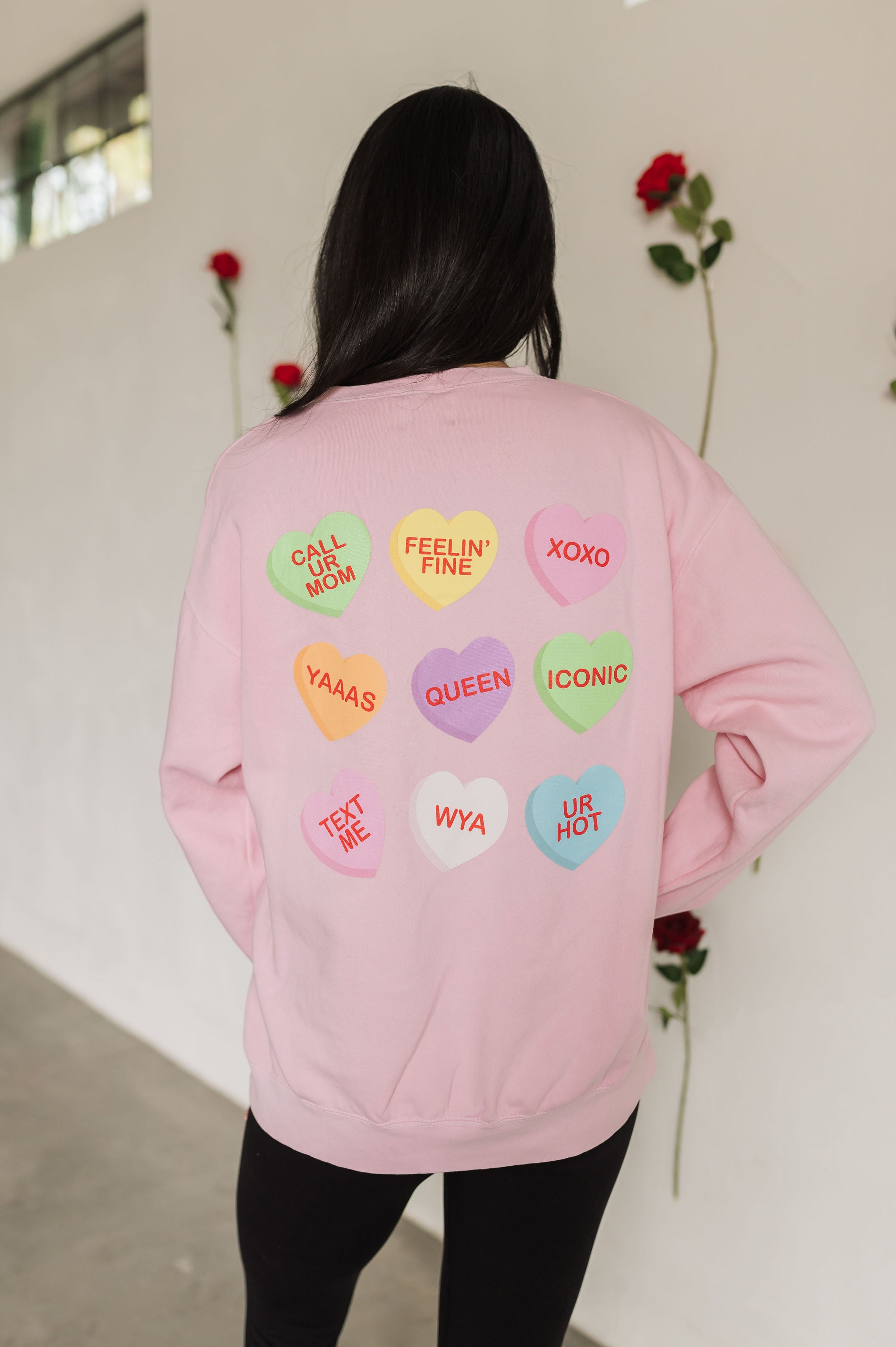 Rear view of The Stanley Sweatshirt crewneck with allover candy heart design.