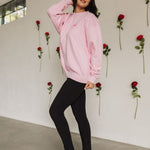 Side view of The Stanley Sweatshirt crewneck with heart graphic detail.