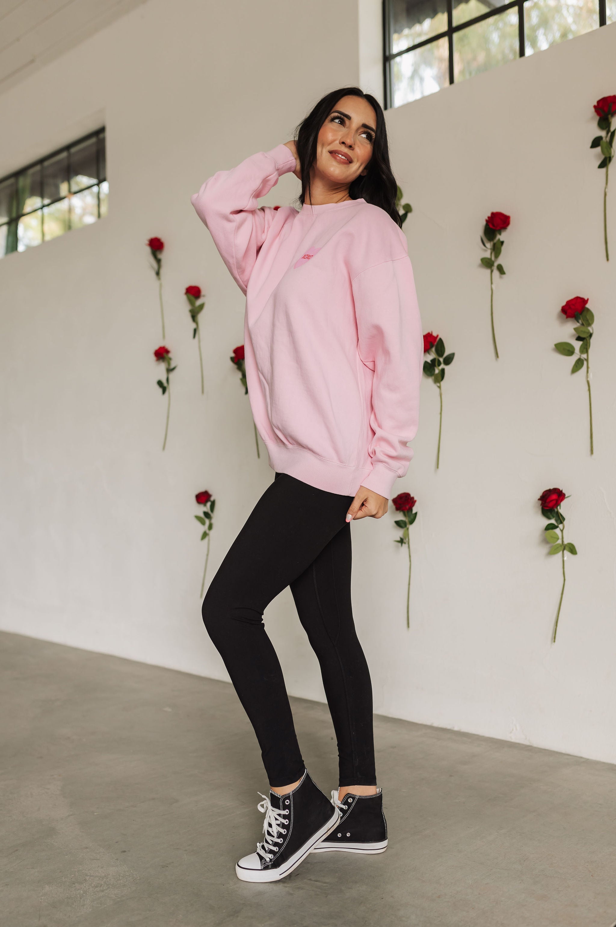 Side view of The Stanley Sweatshirt crewneck with heart graphic detail.