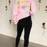 Rear view of The Stanley Sweatshirt crewneck with allover candy heart design.