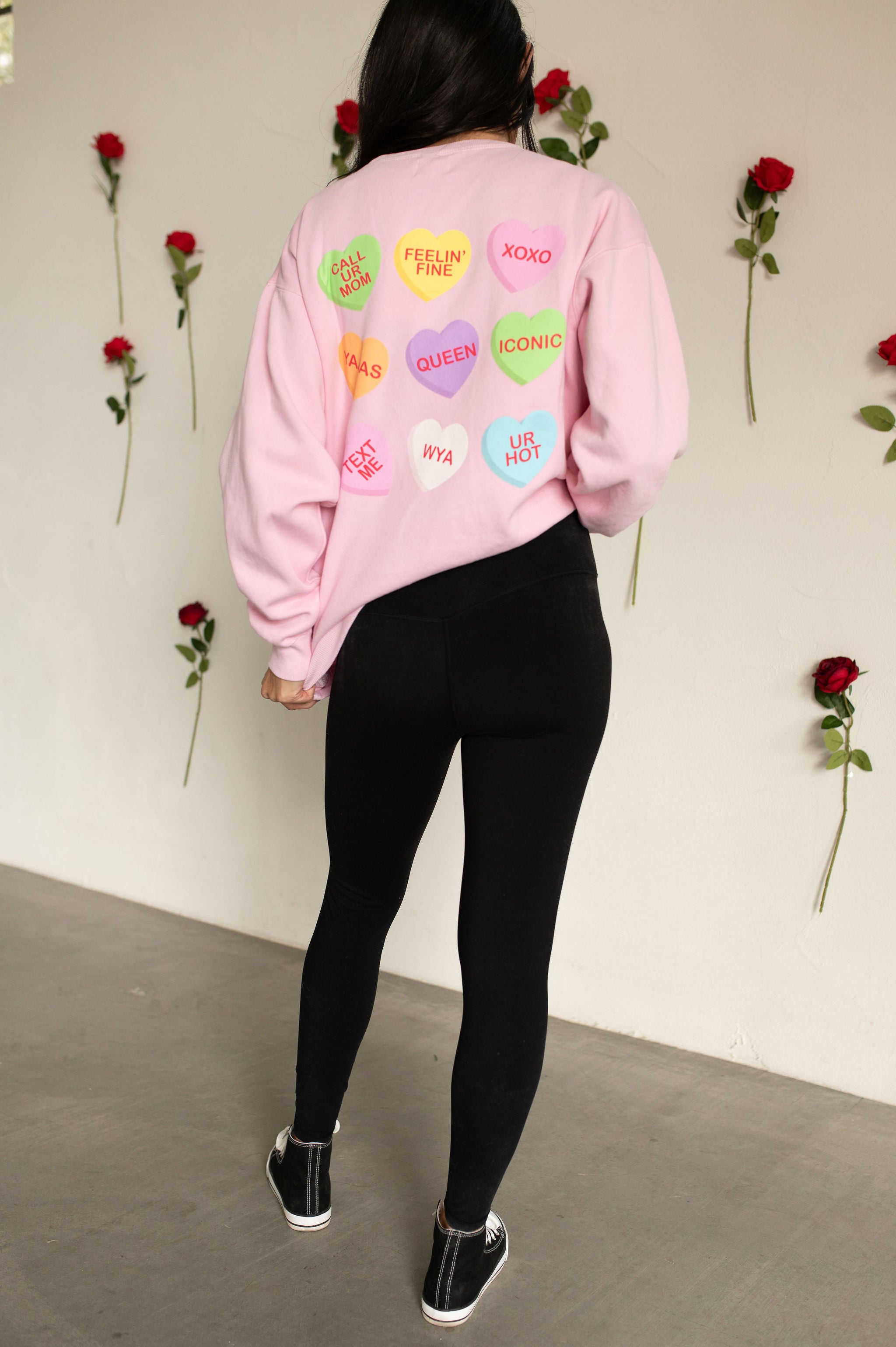 Rear view of The Stanley Sweatshirt crewneck with allover candy heart design.