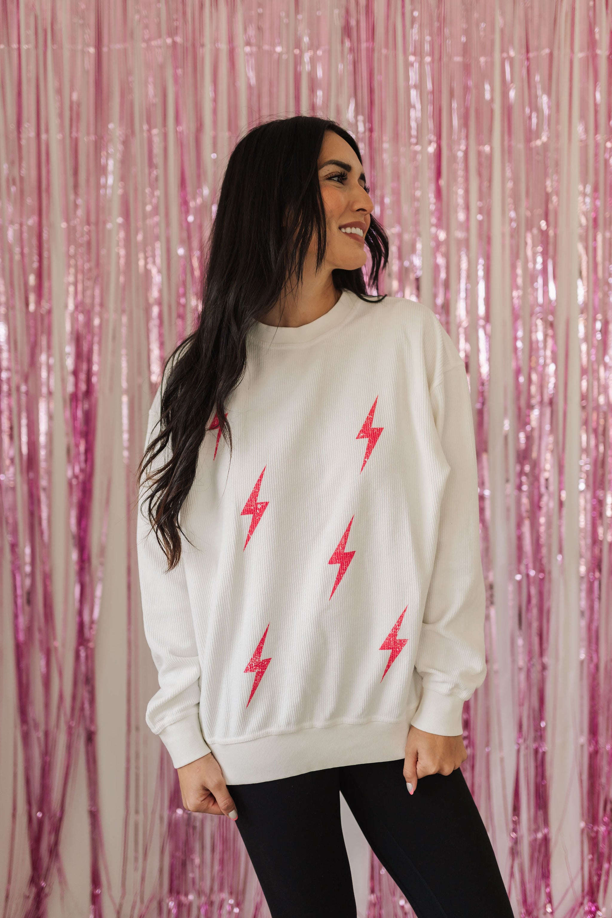 Front view of crewneck Pink Bolts Graphic Sweatshirt with corduroy detail. 