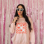 Front view of Candy Hearts Sweatshirt with heart and checkered design. 