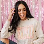 Front view of crewneck XOXO Glitter Graphic Sweatshirt with glitter details.