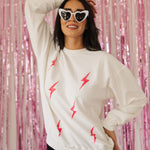 Front view of crewneck Pink Bolts Graphic Sweatshirt with corduroy detail. 