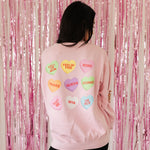 Rear view of The Stanley Sweatshirt crewneck with allover candy heart design. 