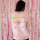 Rear view of The Stanley Sweatshirt crewneck with allover candy heart design. 