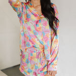 Front view of Early Riser PJ Set with candy heart graphic, button down top, and drawstring waist. 
