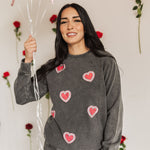 Front view of Glitter Hearts Sweatshirt in aged gray with crewneck and glitter details. 