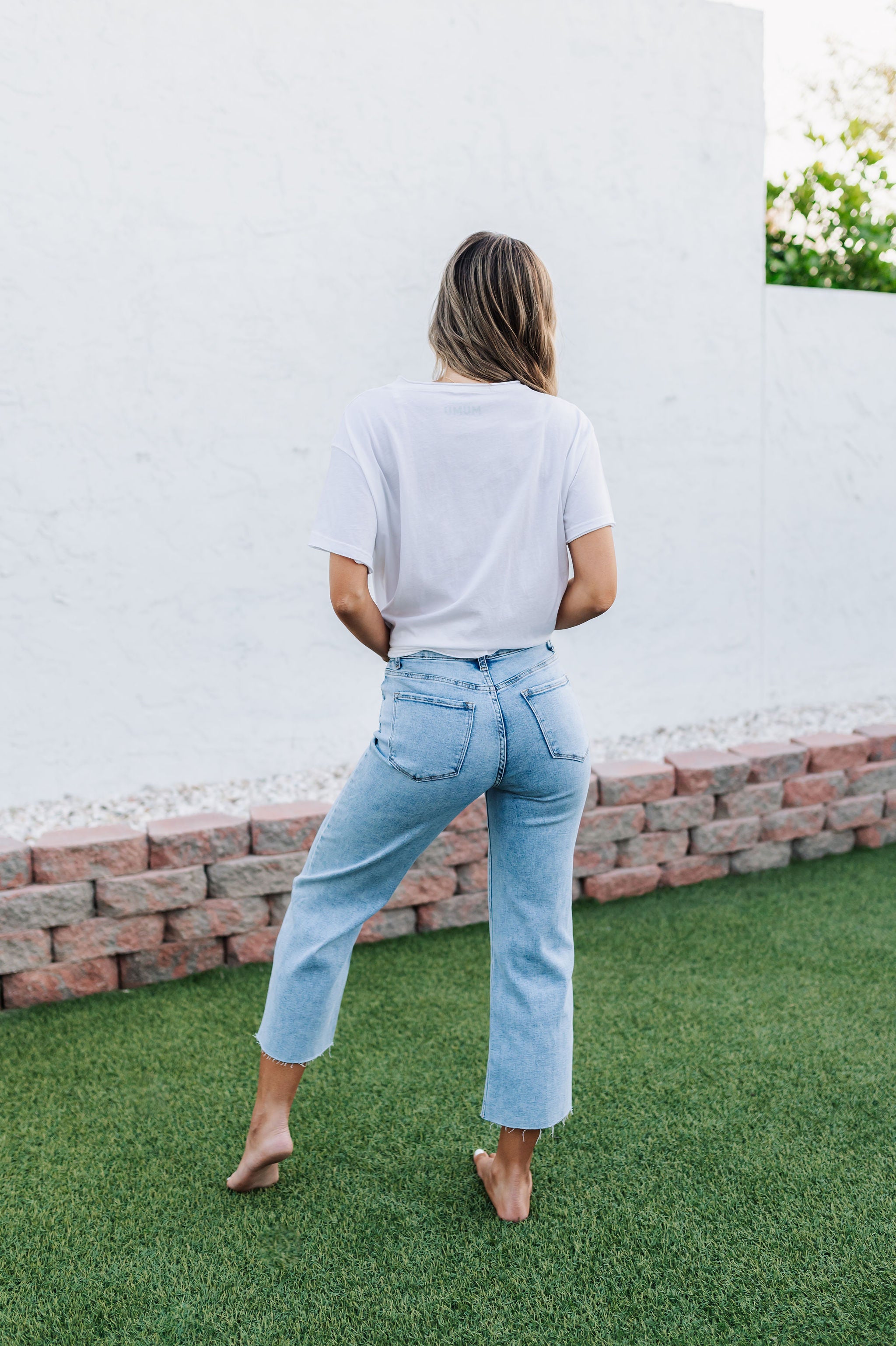 Rear view of Olivia Low Rise Jean with cropped wide leg and rear pockets.