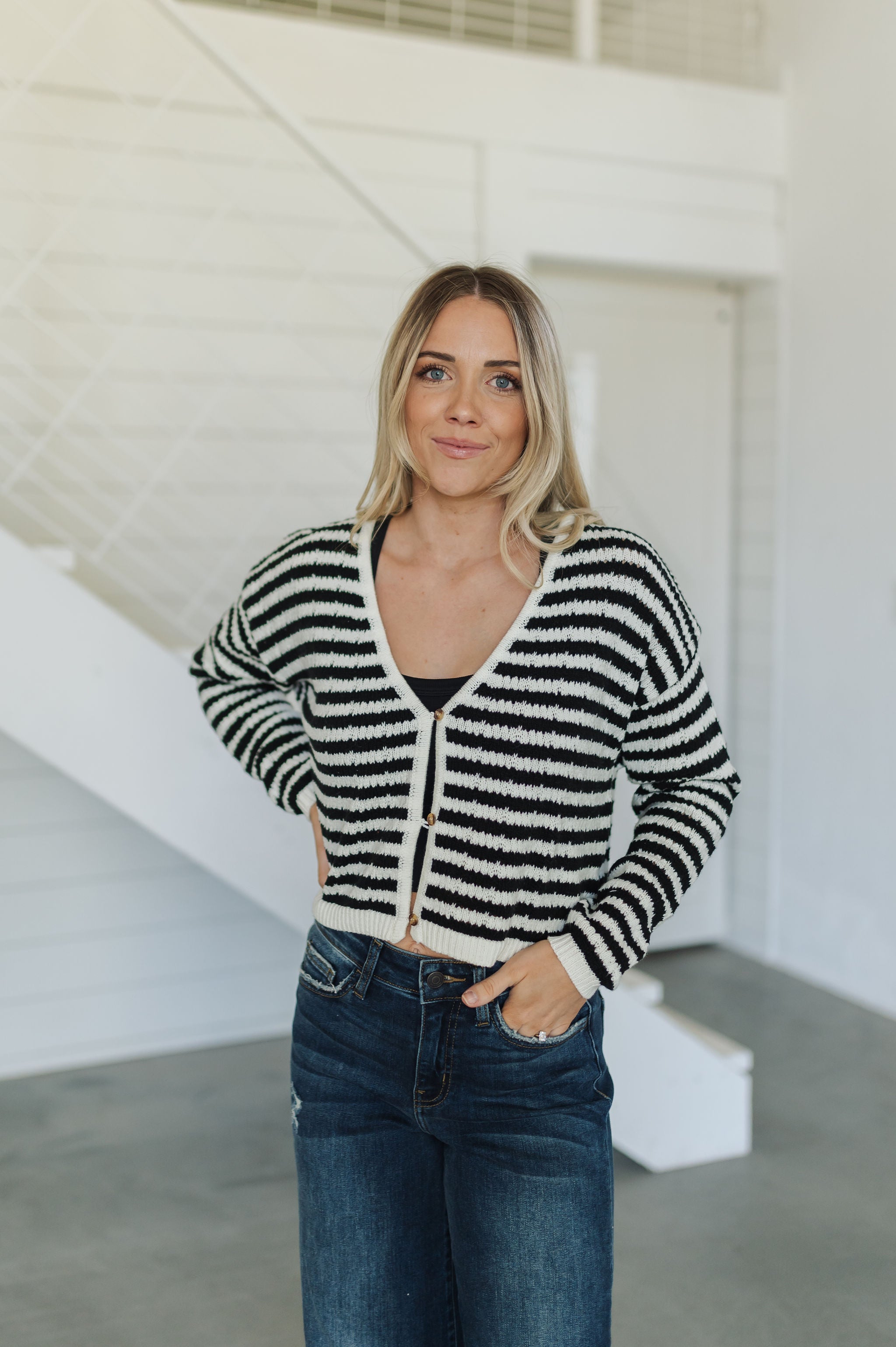 Front view of  Beverly Crochet Knitted Cardigan with button front and black and white stripes. 