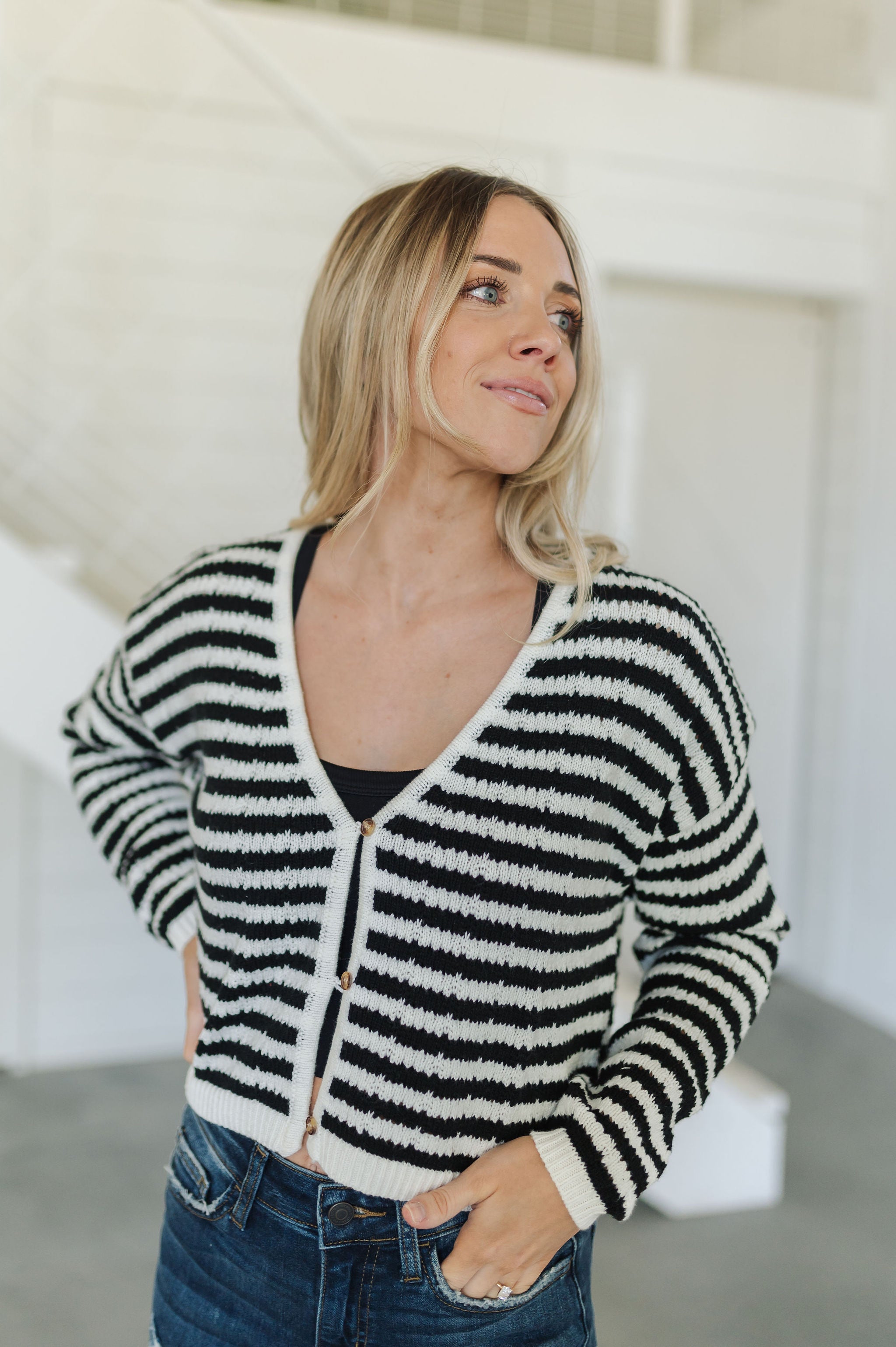 Front view of  Beverly Crochet Knitted Cardigan with button front and black and white stripes. 